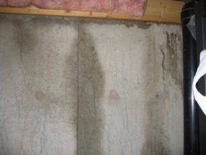 Water leak from the top of the foundation that appears as a basement leak