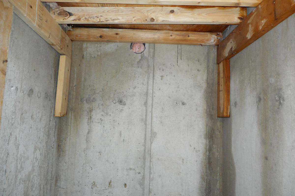 Cold cellar leaks from leaking concrete porches and bad landscaping
