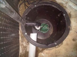 Installed sump pump part of an interior perimeter drain system
