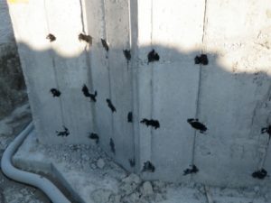 Image of a poured concrete foundation with weeping tile along the footing