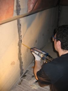 Epoxy injection of leaking foundation crack