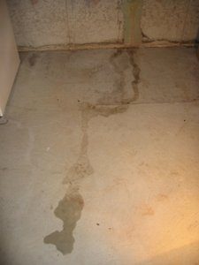 Water on floor caused by a basement leak