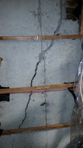 Wide crack in poured concrete foundation