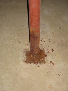 Rusted support post