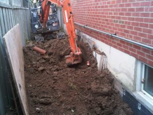 Excavating foundation wall