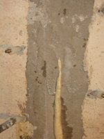 Polyurethane expanding out of homeowner crack repair