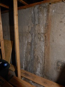 Foundation crack covered with hydraulic cement